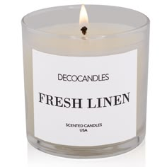 a candle that is sitting in front of a white background with the words fresh linen printed on it