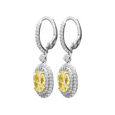 Classic, bold and elegant, these earrings will go great with evening attire or for every day wear Mounted in Platinum 950 and 18k Yellow gold cup to make Yellow Diamonds pop. These earrings feature exceptional pave work, encrusted with almost 1.7ct of white full brilliant cut diamonds creating double halo around Light Yellow Oval diamonds. Lever back also encrusted with pave, you won`t miss a sparkle! Designed and manufactured by M&V Vanguard Jewelry in 2016. Center stones details: 2 Light Y Oval Diamond Earrings, Oval Diamond Earring, Yellow Diamonds, Gold Cup, Double Halo, Dream Jewelry, Yellow Diamond, Evening Attire, Oval Diamond