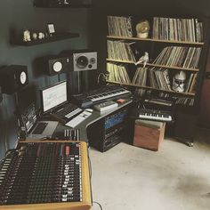 there is a music studio with many records on the shelves