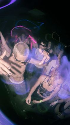 a group of people dancing at a party