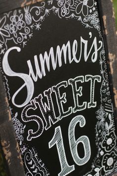 a chalkboard sign that says summer's sweet 16