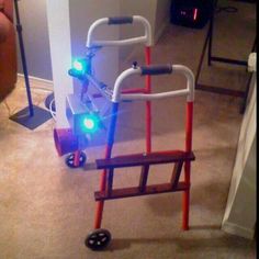 a small toy bike with lights on it's wheels