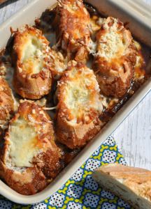 a casserole dish filled with meat and cheese