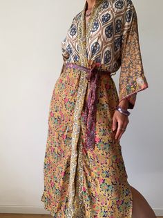 "This is one of a kind patchwork, upcycled silk robe Made free size with wrap tie closing and wide kimono sleeves  Easy and fun to wear around the house or outside as a urban boho style,  flowy kardigan with jeans and tshirt  It is very comfy and feels soft and light  the material is colorful and flowy  made into this unique stylish over all MEAESURE free size length 55\" MATERIAL *polyester  *no lining CARE INSTRUCTIONS  * Wash in warm water * Hand wash recommended * Hang to dry Please visit al Bohemian Beach Patchwork Maxi Dress, Bohemian Patchwork Maxi Dress For Beach, Bohemian Tie-waist Maxi Dress Beach Cover-up, Bohemian Tie Waist Maxi Dress As Beach Cover-up, Bohemian Tie Waist Maxi Dress For Beachwear, Bohemian Tie Waist Maxi Dress For Beach Cover-up, Bohemian Floral Print Wrap Maxi Dress, Bohemian Maxi Dress With Tie Waist, Summer Silk Kimono With Tie Waist