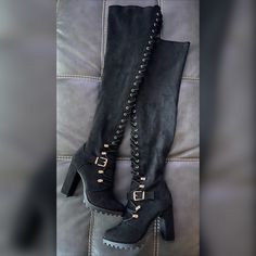 Stretchy Sexy Black Lace Up Thigh High Boots - For Fuller Thighs - Micro Faux Suede Material - Gold Lace Up Accents - Side Zipper Closure - True To Size Outside Heel Height: 4.13" Shaft Height: 22.44" Edgy High Heel Knee-high Boots For Night Out, Trendy Knee-high Heeled Boots For Night Out, Edgy Knee-high Platform Boots For Night Out, Trendy Knee-high Platform Boots For Night Out, Edgy Knee-high Boots For Club In Fall, Edgy Knee-high Boots For Fall Clubbing, Edgy Fall Club Knee-high Boots, Edgy Knee-high Boots For Night Out, Edgy Thigh-high Heeled Winter Boots