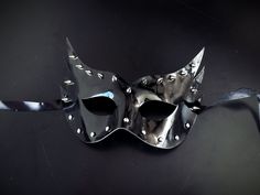 Our striking masquerade mask, crafted from sleek black pleather and adorned with silver studs and spikes, is the ultimate accessory for those who dare to stand out. 

Designed for all-night wear, our mask ensures a secure and comfortable fit.


Age Group/Gender - Adult/unisex

Size/Type - One size fits all adults

Mask Color - Black

Mask Material - Pleather

Special Features - Spikes Black Punk Eye Mask, Black Punk Masks For Party, Punk Style Eye Mask For Masquerade, Black Punk Party Masks, Punk Black Party Masks, Punk Eye Mask For Party, Punk Style Eye Mask For Party, Masquerade Mask Black, Mens Masquerade Mask