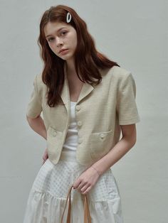 This is a modern and feminine jacket by SIEERING that is made out of high quality and sturdy material. With distinctive mood of the design and comfortable wear, you can style it for your casual daily outfit.- Binding finishing inside- Clean design and unique button- Feminine and romantic mood Chic Beige Cropped Jacket With Lapel Collar, Chic Beige Cropped Jacket With Pockets, Chic Cropped Beige Jacket With Pockets, Classic Beige Cropped Jacket With Pockets, Beige Blazer With Buttoned Pockets For Work, Spring Beige Blazer With Buttoned Pockets, Spring Beige Blazer With Button Cuffs, Beige Buttoned Cropped Jacket For Work, Beige Blazer With Button Cuffs For Spring