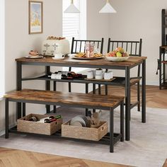 a dining table with four benches and baskets under it