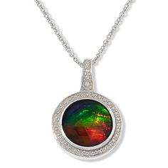 Discover the enchanting allure of the Canadian Ammolite Gems Round Ammolite Pendant by Kenneth Bradley. This exquisite piece showcases the vibrant, rainbow hues of Ammolite, a rare gemstone found exclusively in Alberta, Canada.

- **Material:** Sterling silver with rhodium plating
- **Gemstone:** Bezel-set, 10mm round Ammolite/Quartz triplet
- **Pendant Size:** Approximately 13/16"L x 9/16"W
- **Chain Length:** 18"L x 1/16"W with a 2" extender
- **Clasp:** Lobster claw
- **Gender:** Female
- **A Multicolor Round Jewelry With Polished Finish, Multicolor Polished Round Jewelry, Multicolor Round Jewelry With Bezel Setting, Multicolor Round Bezel Set Jewelry, Multicolor Jewelry With Bezel Setting, Iridescent Round Gemstone Jewelry, Iridescent Gemstone Jewelry, Polished Opal Jewelry, Round Opal Jewelry With Polished Finish