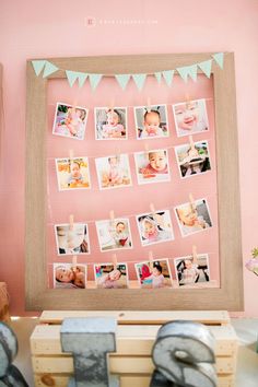 a wooden frame with photos hanging on it and some letters in front of the photo