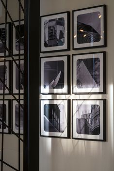 black and white photographs hanging on the wall