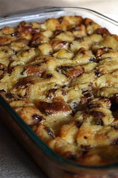 a casserole dish filled with bread and raisins