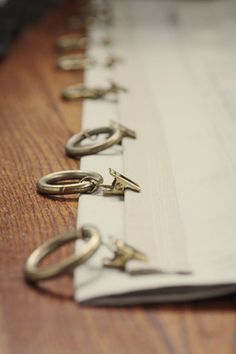 several pairs of scissors are lined up on a table