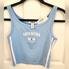 - Embroidered Argentina Logo & Flag - Sleeveless - Sewn In Side Stripes - Never Been Worn Casual Embroidered Fitted Tank Top, Fitted Blue Letter Print Tank Top, Argentina Logo, Argentina Football, Side Stripe, Blue White, Color Blue, Crop Top, Cottage