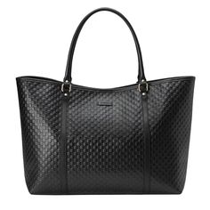 This large Gucci tote bag is made of black leather and embossed with micro Guccissima monogram. Dual Leather Handles with a 7" dropClose Linen Lining"Gucci" Leather Tab Interior Open Top with Magnetic Snap Featuring leather handles, brass hardware and leather trim. COLOR: Black MATERIAL: Leather MEASURES: H 12” x L 20” x D 8” Gucci Tote Bag, Gucci Tote, Gucci Leather, Trim Color, Diaper Backpack, Leather Handles, Casual Backpack, Handbag Backpack, Leather Handle