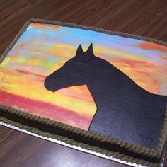 a decorated cake with a horse on it