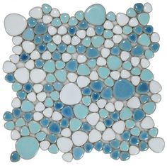 a blue and white mosaic tile with circles on it's sides, in the shape of pebbles