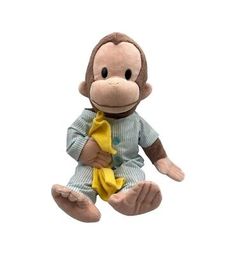 a stuffed monkey with a banana in its hand