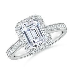 an emerald cut diamond ring with diamonds around it