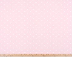 a pink and white polka dot background