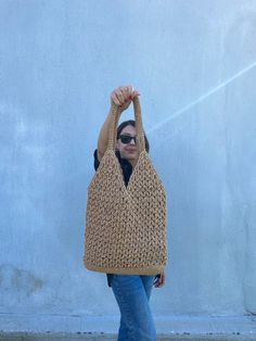 This crochet raffia tote bag is made with natural beige paper rope. Made with crochet.  It is big size, lightweight and durable. I made this Boho Straw Beach Bag for women who want to look trendy and stylish. You can use it on your shoulder.   The inside of this large raffia shoulder bag is ideally sized for beach or daily use. It's not lined.  This crochet raffia tote bag is great gift for birthday, mother's day, and other special occasions. The straw beach bag's measures; Width: 13,5 inches (3 Eco-friendly Sand Crochet Bag For Everyday Use, Neutral Woven Crochet Tote Bag, Everyday Crochet Bucket Bag In Natural Color, Natural Crochet Bag For Daily Use With Open Weave, Natural Color Crochet Bag For Daily Use, Eco-friendly Handwoven Beige Crochet Bag, Everyday Natural Woven Crochet Bag, Everyday Crochet Natural Bucket Bag, Cream Rectangular Crochet Jute Bag