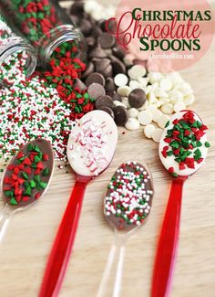 christmas chocolate spoons with sprinkles and candy in them on a table