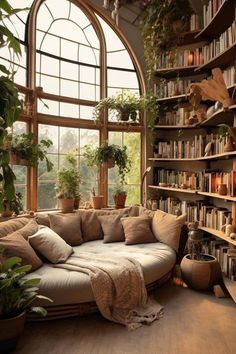 a living room filled with lots of plants and bookshelves next to a large window