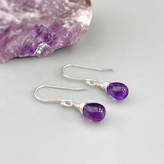 Handmade Amethyst sterling silver boho earrings for women. Purple Amethyst gemstones hang from hand crafted sterling silver, Rose Gold Fill or 14k Gold Fill ear wires or leverbacks. Dainty lightweight earrings perfect for everyday wear.  Handmade Jewelry crafted with love one at a time in my northern Michigan studio. Gemstones are nature's creations and may vary slightly in color and inclusions, but all are lovely and hand selected to match. These earrings are Dainty approx 3/4" (18mm) long including the ear wires / leverbacks. The gemstones are approx. 1/4" wide Amethyst is February's birthstone. We have more Handmade Amethyst jewelry, hair accessories, and hair jewelry available in our store: https://www.etsy.com/shop/BlueHeronJewelry?ref=seller-platform-mcnav&search_query=Amethyst I lov Gemstone Drop Earrings As A Gift For Her, Sterling Silver Drop Fine Jewelry, Amethyst Drop Earrings Fine Jewelry, Silver Amethyst Teardrop Jewelry, Silver Teardrop Amethyst Jewelry, Fine Jewelry Amethyst Drop Earrings, Sterling Silver Teardrop Birthstone Gemstones, Purple Bohemian Everyday Jewelry, Purple Teardrop Crystal Earrings In Sterling Silver