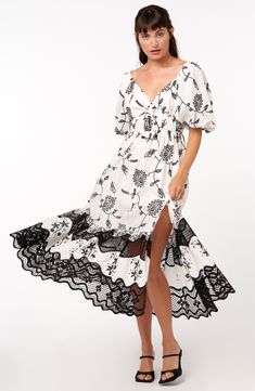 This cotton dress is adorned by beatuifully embroidered blooms and lacy insets that add to the sweet energy of your look. 50" length Slips on over head V-neck Elbow-length sleeves Partially lined 100% cotton Hand wash, dry flat Imported Asian Owned/Founded Spring Feminine Lace Dress With Contrast Lace, Spring Embroidered Short Sleeve Lace Dress, Spring Short Sleeve Lace Embroidered Dress, Spring Dresses With Contrast Lace Detail, Spring Embroidered Midi Dress With Lace Trim, Summer Embroidered Lace Dress With Floral Print, Summer Floral Print Lace Embroidered Dress, Spring Floral Print Lace Embroidered Dress, Summer Lace Embroidered Dress With Floral Print