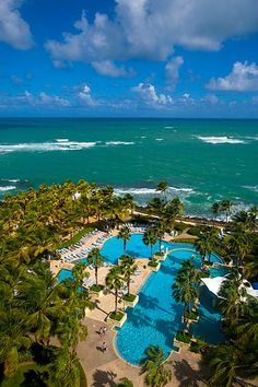 an aerial view of the pool and ocean