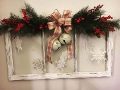 an old window is decorated with christmas decorations