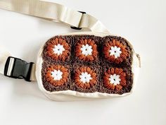 upcycled crochet crossbody / belt bag is the perfect grab-and-go bag. Enough space for the essentials- keys, wallet, phone - without slowing you down. Perfect bag for the minimalist who loves the cottage core aesthetic. The crochet detailing is fixed to bag which has an adjustable buckle strap, an outer zipper pouch, and inner mesh pockets. Keep all of your essentials close by when you're on the go! Grocery store, gym, errands, in the comfort and security of a crossbody belt bag.   Dimensions: 6 Crochet Belt Bag, Granny Square Purse, Crossbody Belt Bag, Crochet Belt, Square Purse, Cottage Core Aesthetic, Go Bags, + Core + Aesthetic, Crochet Details