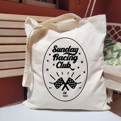 These fun totes are the perfect gift for any racing fan They are made from 100% cotton and feature Sunday Racing Club lettering in a retro style font, as well as a checkered flag image accompanied by stars. These bags are printed on one side and left blank on the back side. Materials: 100% cotton tote bag, htv All bags come with washing and care instructions on a label sewn on inside. Retro Rectangular Canvas Bag With Letter Print, Retro White Bag With Letter Print, Retro White Bags With Letter Print, Retro Canvas Bag As A Gift, White Retro Bags With Graphic Print, Flag Image, Racing Bicycle, Racing Club, Bicycle Race