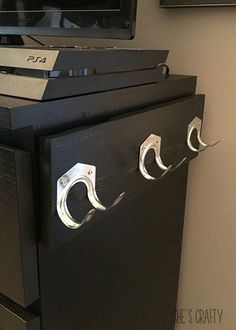 a black cabinet with two metal handles on it