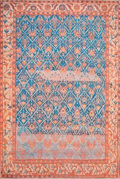 an antique rug with blue and orange colors