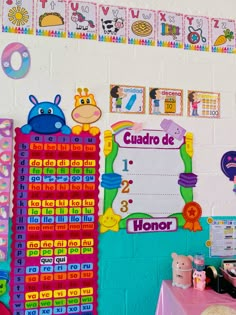 a classroom wall decorated with colorful posters and numbers for children's birthdays or special occasions