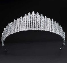 Brilliant CZ Wedding and Quince Tiara This stunning tiara features genuine platinum silver plating and glistening 5A quality cubic zirconia crystals. The classic shape and 1.75" size makes this headpiece fit for a princess! Color: Silver. Style: hp1031. Size: The decorated portion is about 1.75 " tall at the center peak. A fabulous headpiece for your wedding day or quinceanera! Please allow 2-3 weeks for delivery. Shipping Policy . Return Policy Diamond Tiara Wedding, Quinceanera Tiaras, Bridal Headwear, Royal Tiaras, Bridal Wedding Hair, Hair Jewelry Wedding