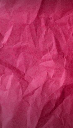 a close up view of pink tissue paper