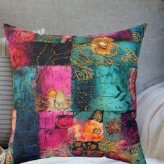 a colorful pillow sitting on top of a couch