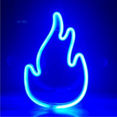 a blue lit up fire symbol on a dark surface with the light reflecting off it's side