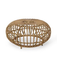 a round wicker ottoman with an intricate design on the top and bottom, made out of