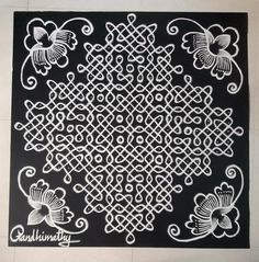 an intricately designed design on the floor is shown in black and white, with butterflies