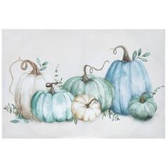 four pumpkins painted in different colors and sizes