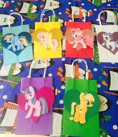 little pony bags are lined up on the table