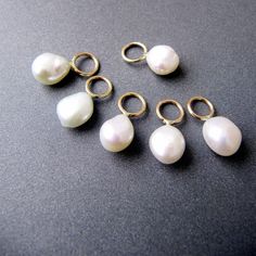 Baroque Pearl 14k Gold Charm for Earrings 5.85mm Ring with 4mm Hole The ring faces the front - made specially for earrings 5-7 x 6mm Cultured Freshwater Pearl Top grade lustrous pearls *Matching charm for necklace (with perpendicular ring) shown in the last photo: https://www.etsy.com/listing/1359375425/14k-gold-baroque-pearl-charm-5-7mm?click_key=b0075d0d0752b43df944cc89cfcb5f1e6f4e42bd%3A1359375425&click_sum=3b2cb529&ref=shop_home_active_64&crt=1 Elegant Charms Earrings For Anniversary, Elegant White Charm Earrings, Elegant White Earrings With Charms, Elegant 14k Gold Charm Earrings, Elegant 14k Gold Earrings With Charms, Anniversary Charms Earrings Round Shape, Elegant Tiny Teardrop Jewelry, The Ring Face, Gold Baroque