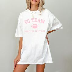 Score big with this Go Team retro football shirt! Whether you're tailgating or cheering from the couch, this funny sports shirt is perfect for game day vibes. Show off your style with this classic game day shirt, the ideal tailgate shirt for fans who just love the excitement! 🛒 HOW TO ORDER 1.Please check and review all photos 2.Select your shirt color and size from the drop-down menu 3.Choose your quantity  4.Click "add to cart", then feel free to go back and add more of your favorite items 5.Check out and wait for your package to arrive!  ...Small business happy dance in progress 💃💕 ❤ NEW ARRIVALS -Click here 👉 https://risingtidethreads.etsy.com, and click the 'heart' icon 🤍 to get updates on new releases and popular designs! -Check out the sweatshirt version of this design here: *U Funny Sports Shirts, Tailgate Shirt, Retro Football Shirts, Go Team, Funny Sports, Sports Shirt, Retro Football, Team Shirt, Game Day Shirts