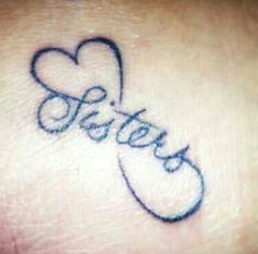 a small tattoo with the word sister written in cursive font and a heart