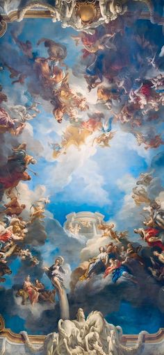 the ceiling is painted with many different colors and designs, including angels in clouds above them