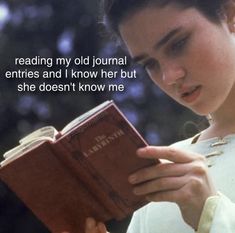 a woman reading a book with the caption reading my old journal entries and i know her but she doesn't know me