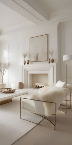 a living room with white furniture and a fireplace